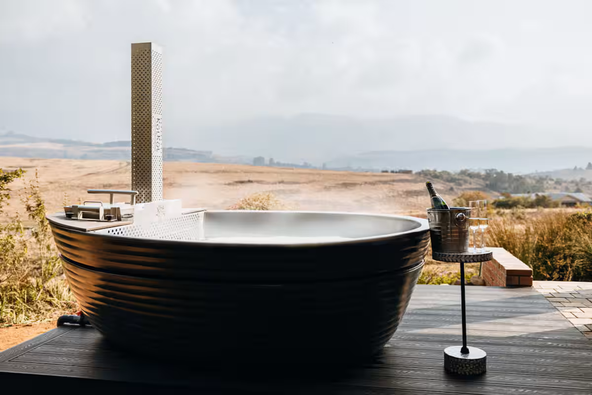 Wood-fired hot tub with Drakensberg mountain views at Zebra View self-catering holiday home